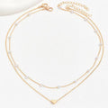 Collar Doble con Cuentas de Efecto Perla y Corazón · Dorado