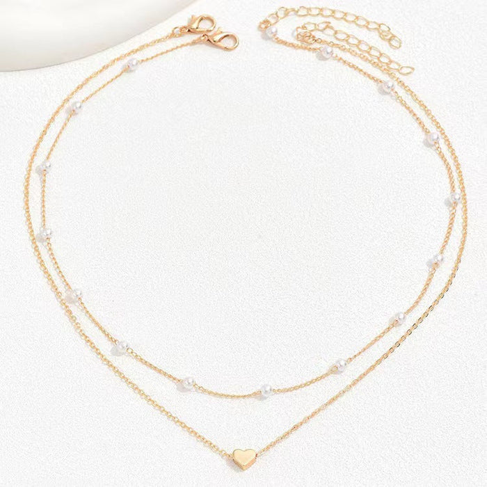 Collar Doble con Cuentas de Efecto Perla y Corazón · Dorado