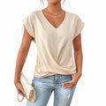 Blusa albaricoque con escote en V y bajo cruzado