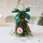 Mini Árbol Decorativo de Navidad 21 cm – 2 Diseños · Lazo verde · Papá Noel